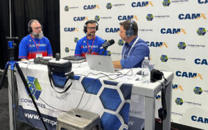 Three men recording a podcast episode during CAMX 2024