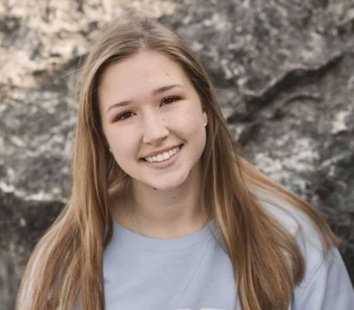 A young girl smiling