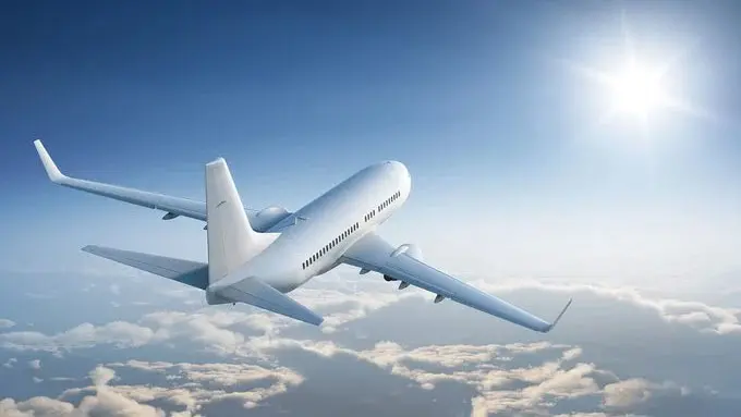 An airplane flying through the sky